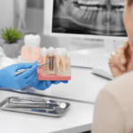 Dental consultation with implant model demonstration